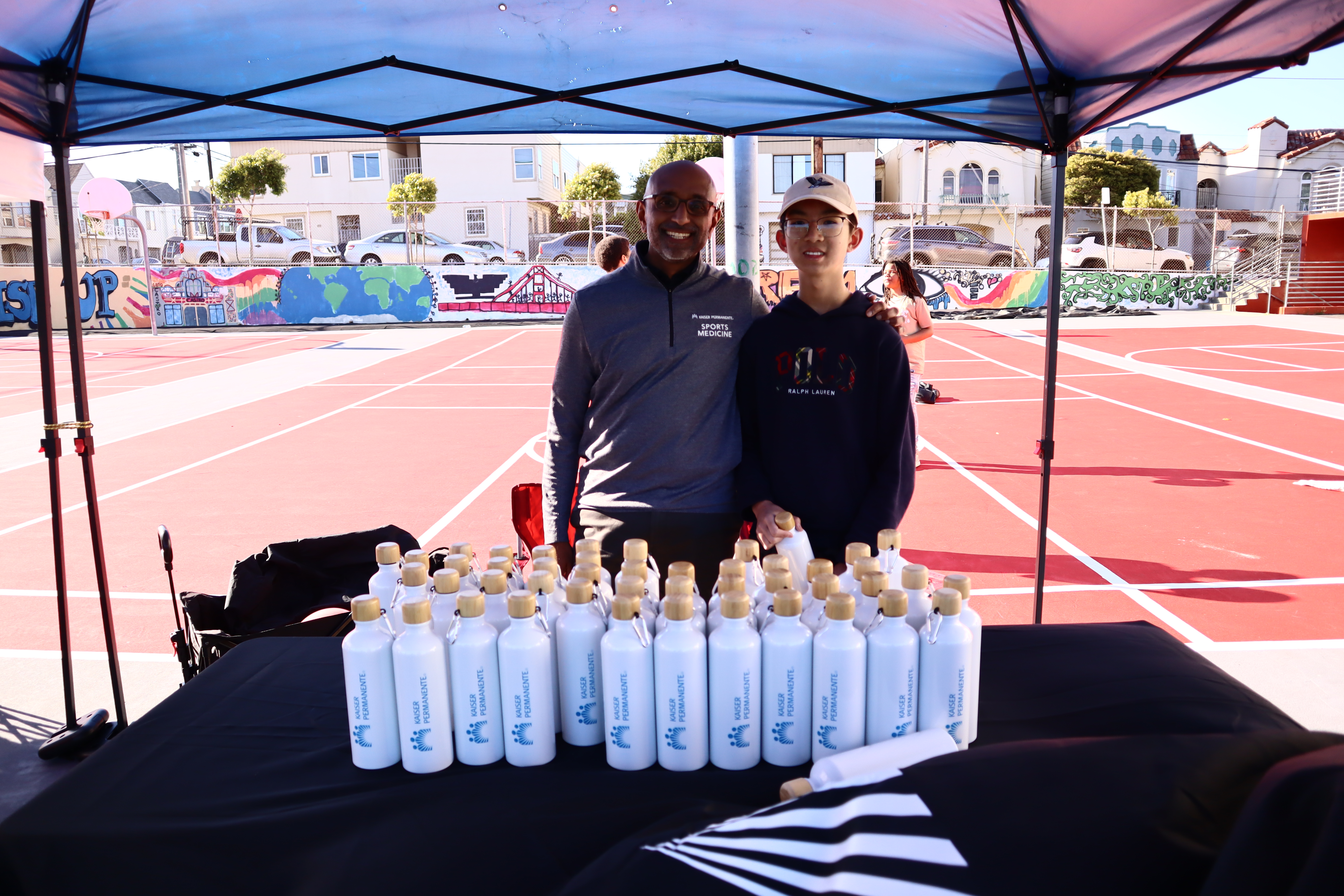 Justin Chen participating in a community event table.