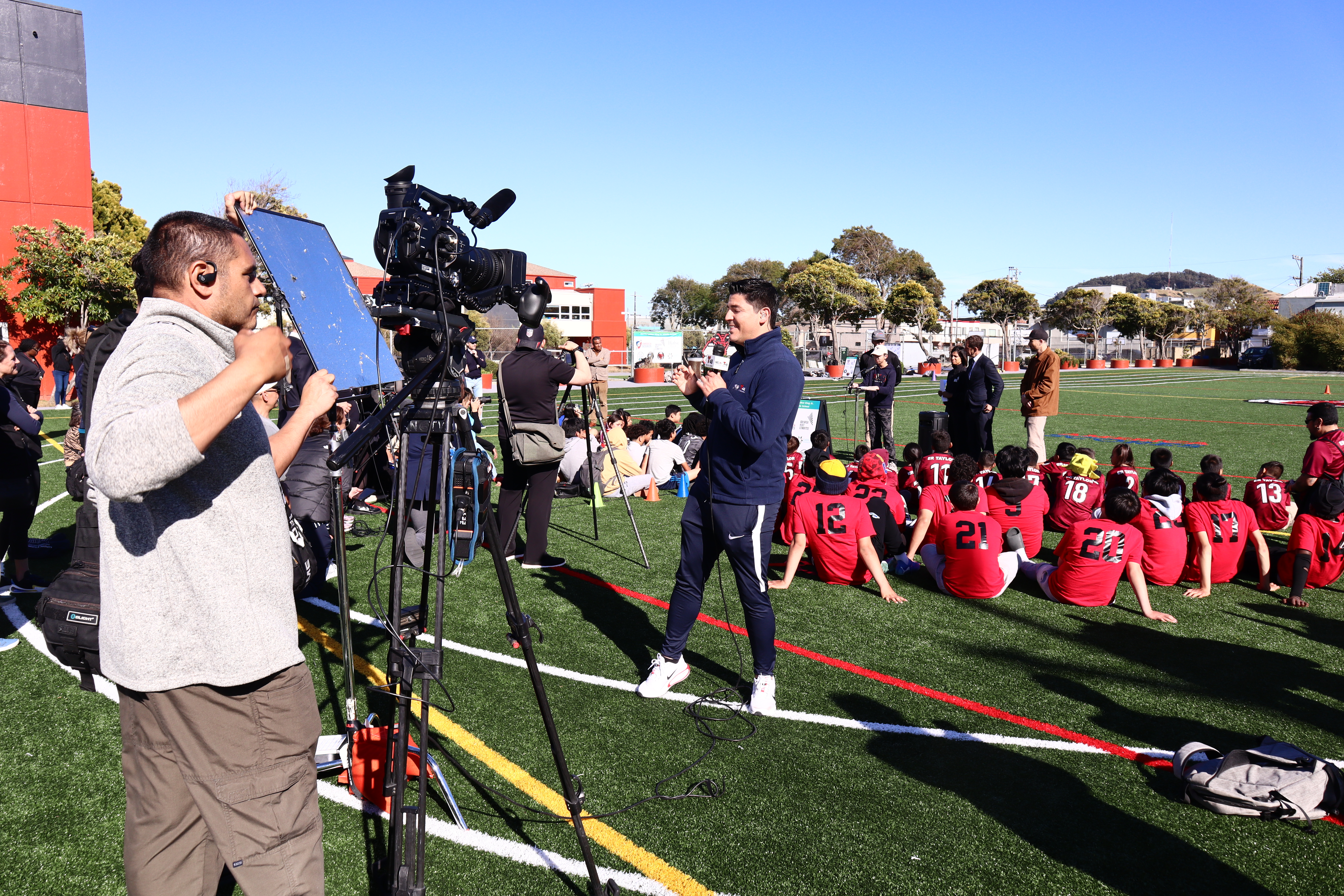 Media covering the MLK Field of Dreams event.